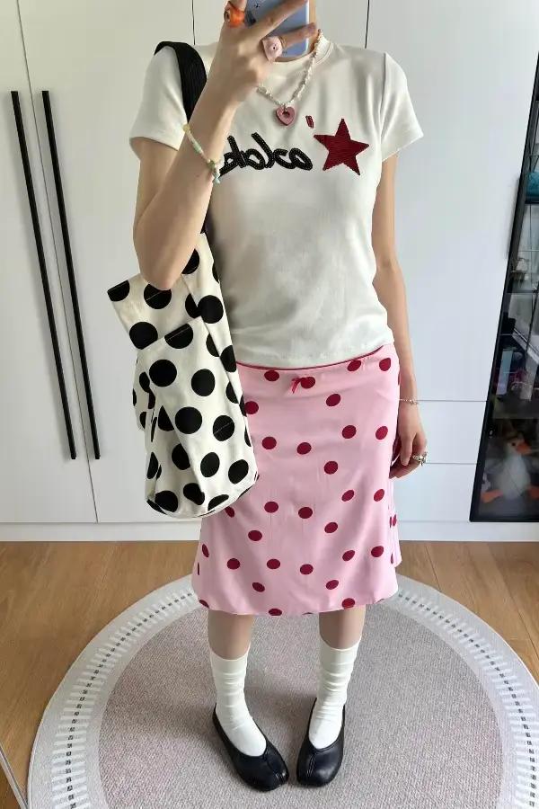 Jupe mi-longue tube droite à pois rose style rétro américain pour femme