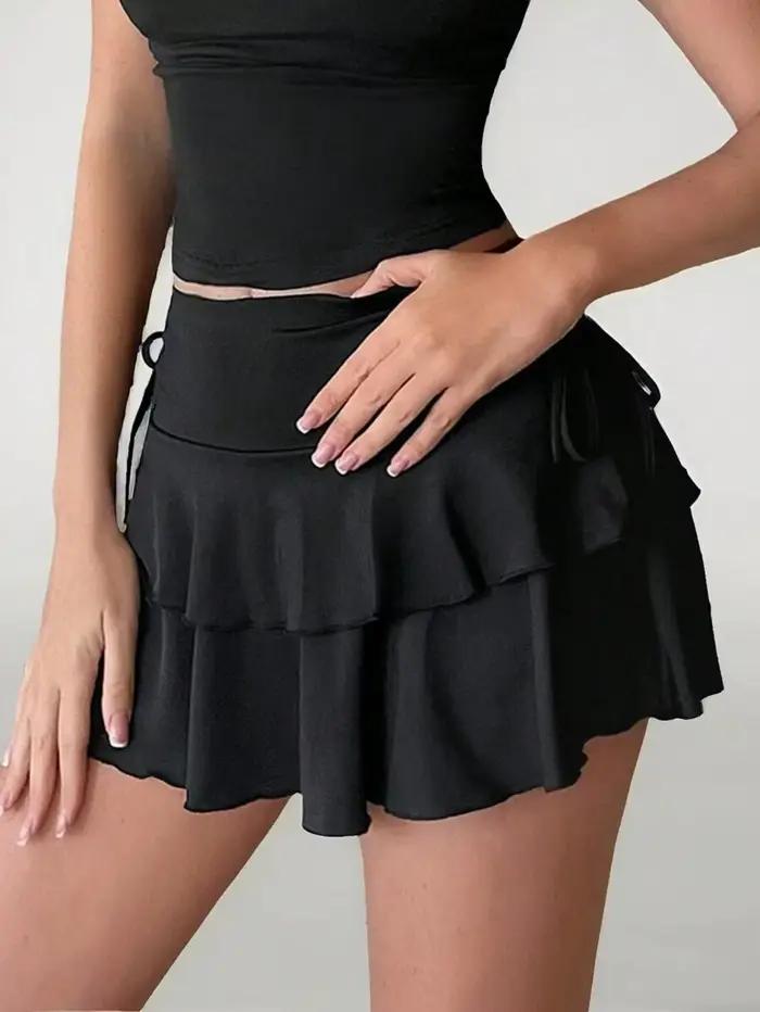 Jupe mini évasée unie à taille haute avec cordon de serrage et détail plissé, idéale pour les tenues de fête, de plage et de vacances d'été