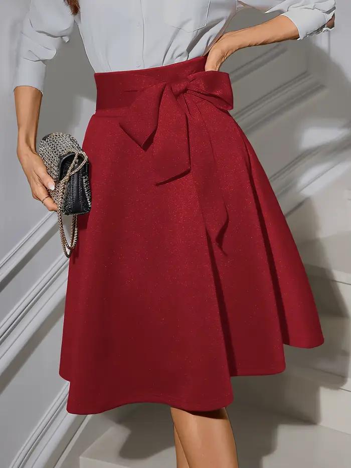 Jupe midi évasée élégante pour femme à taille haute avec ceinture à nœud