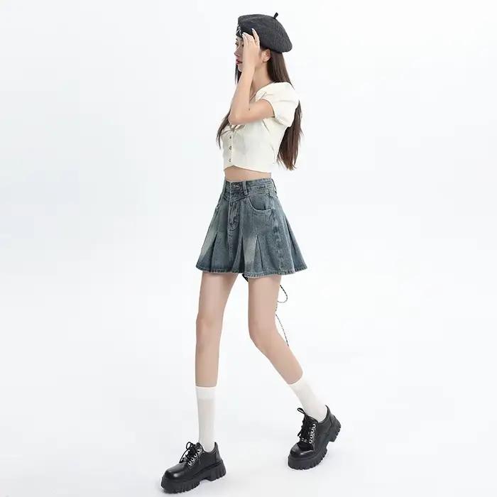 Jupe courte plissée en jean bleu taille haute pour femme