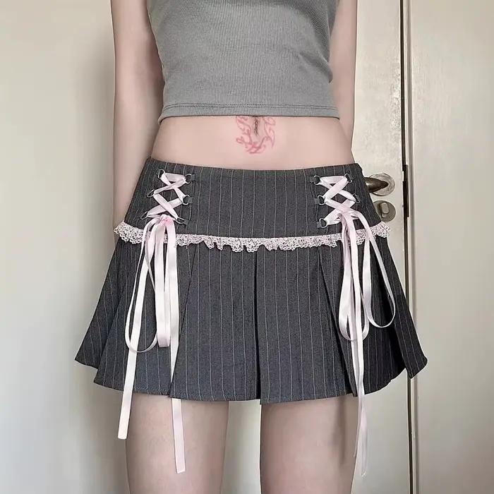 Jupe plissée en tissu de costume de ballet à rayures contrastées avec nœud et dentelle