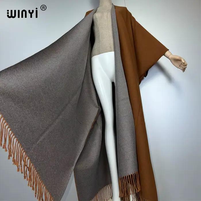 WINYI tenues d'hiver pour femmes de luxe fourrure glands manteau épais confortable chaud couleur unie mode manteau poncho longue robe en duvet