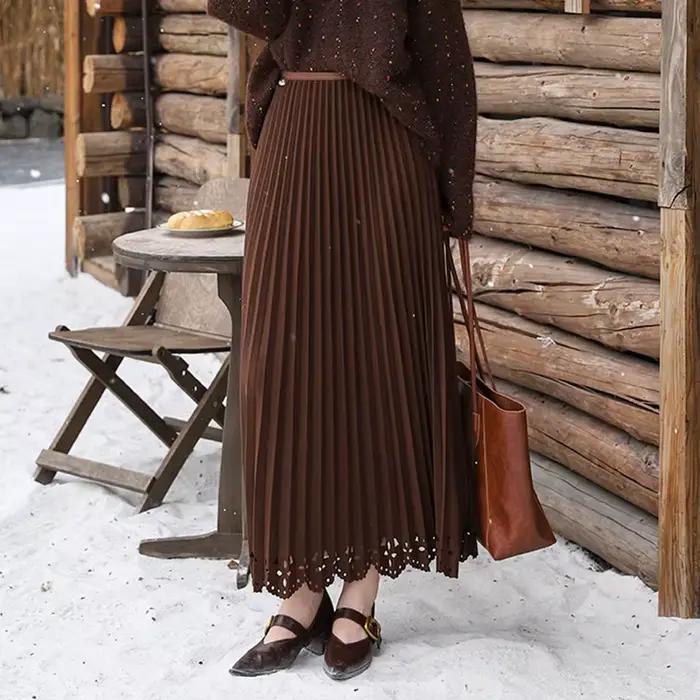 Femmes solide Vintage jupe plissée fleur creuse a-ligne Medi longue Maxi