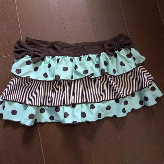 Jupe courte évasée à pois avec nœud créatif style décontracté mode vintage street spice femme occasions spéciales
