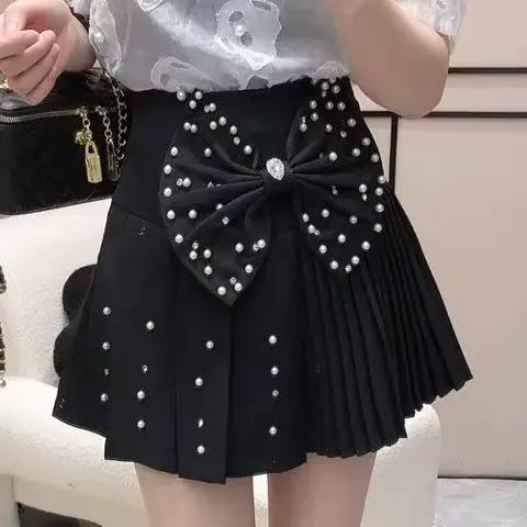 Jupe plissée à nœud perlé style diamant français