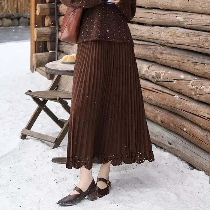 Femmes solide Vintage jupe plissée fleur creuse a-ligne Medi longue Maxi