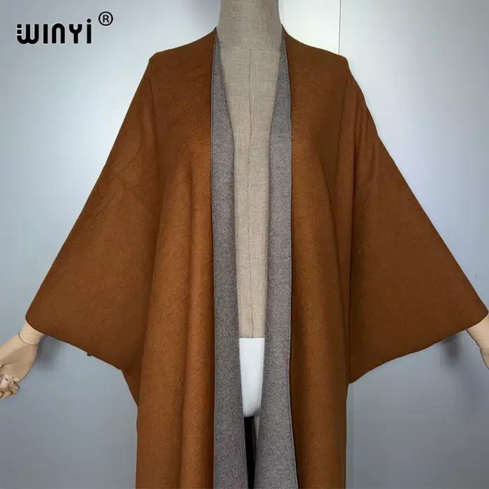 WINYI tenues d'hiver pour femmes de luxe fourrure glands manteau épais confortable chaud couleur unie mode manteau poncho longue robe en duvet