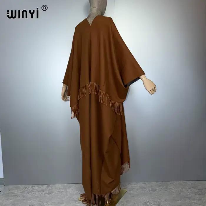 WINYI tenues d'hiver pour femmes de luxe fourrure glands manteau épais confortable chaud couleur unie mode manteau poncho longue robe en duvet