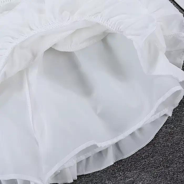 Jupe bouffante blanche en mousseline de soie à volants