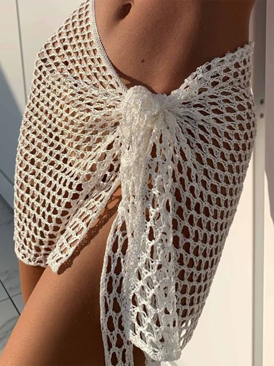 Femmes jupe de plage évidé solide noir blanc jaune vert tricoté Mini jupe pour les femmes vacances d