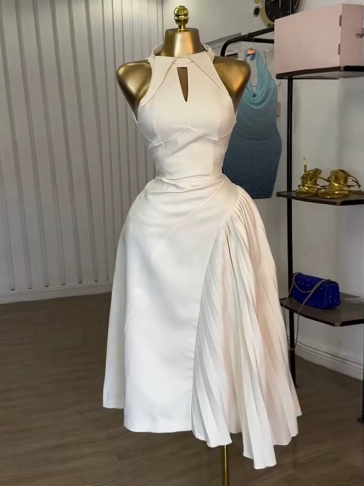 Robes mi-longues sans manches pour femmes, à la mode, asymétriques plissées et creuses, parfaites po
