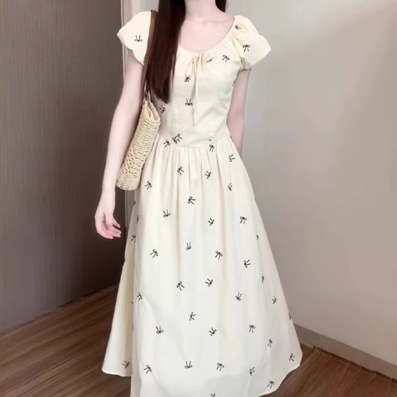 Robe longue imprimée nœud français pour femme été 2026 style à la française coupe trapèze manches bouffantes occasion spéciale vacances
