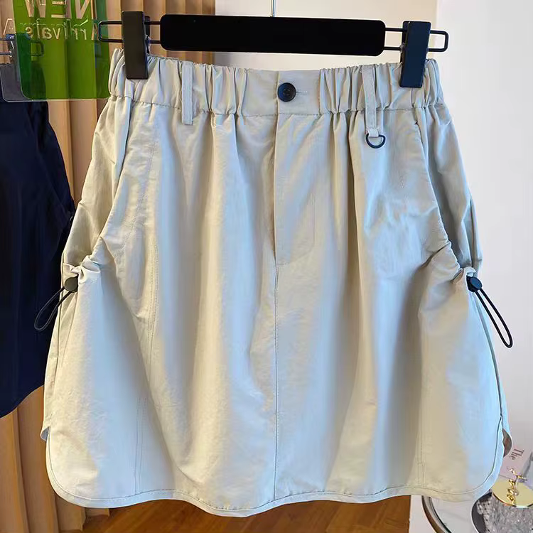 Version coréenne vêtements de travail jupe courte ample taille haute rétro décontracté tendance demi-longueur